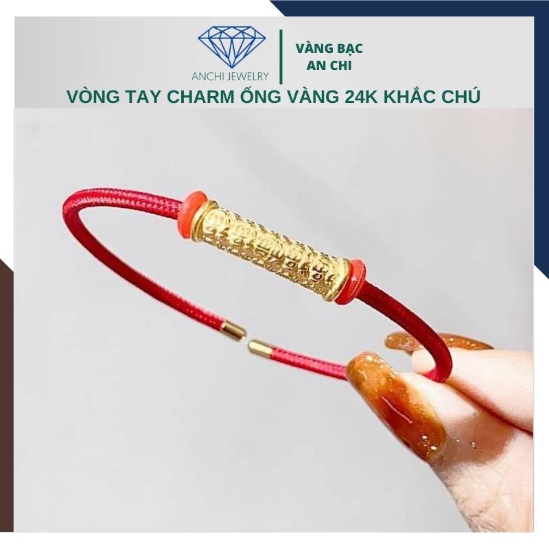 Vòng tay dây cước 2mm đeo charm ống vàng khắc chú bình an 24k, có giấy bảo đảm của tiệm Anchi jewelry