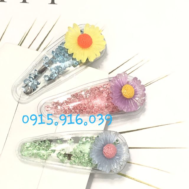 Kẹp tóc trong suốt đính bông cúc