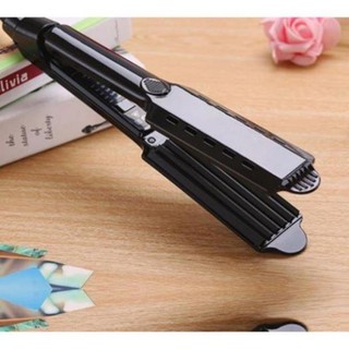 Máy dập xù / Máy là thẳng và dập xù đa năng giúp làm thẳng tóc và tạo nên những kiểu tóc xoăn cơ bản