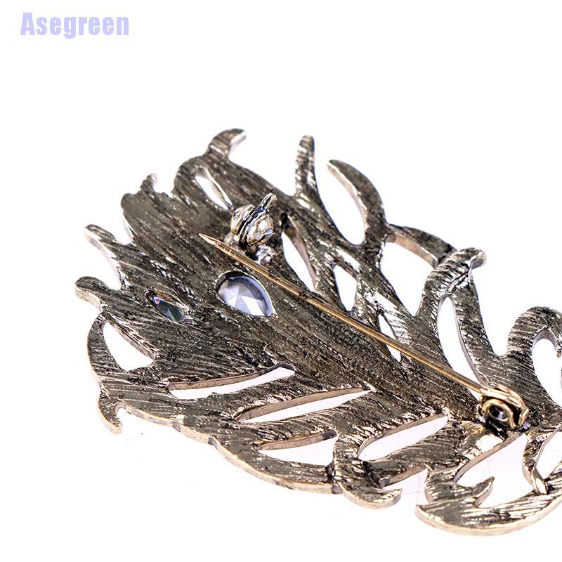 Ghim cài áo hình lông công đính đá pha lê sang trọng