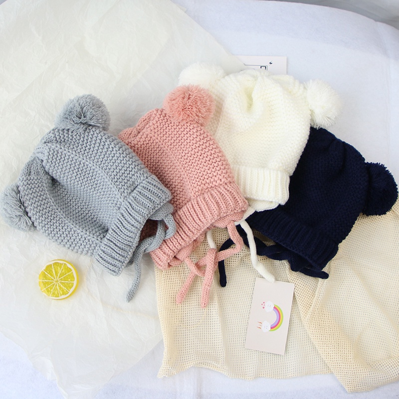 Mũ dệt kim mềm mại thiết kế hình tai thỏ phối quả bóng lông xù ấm áp màu trơn thiết kế dễ thương cho bé