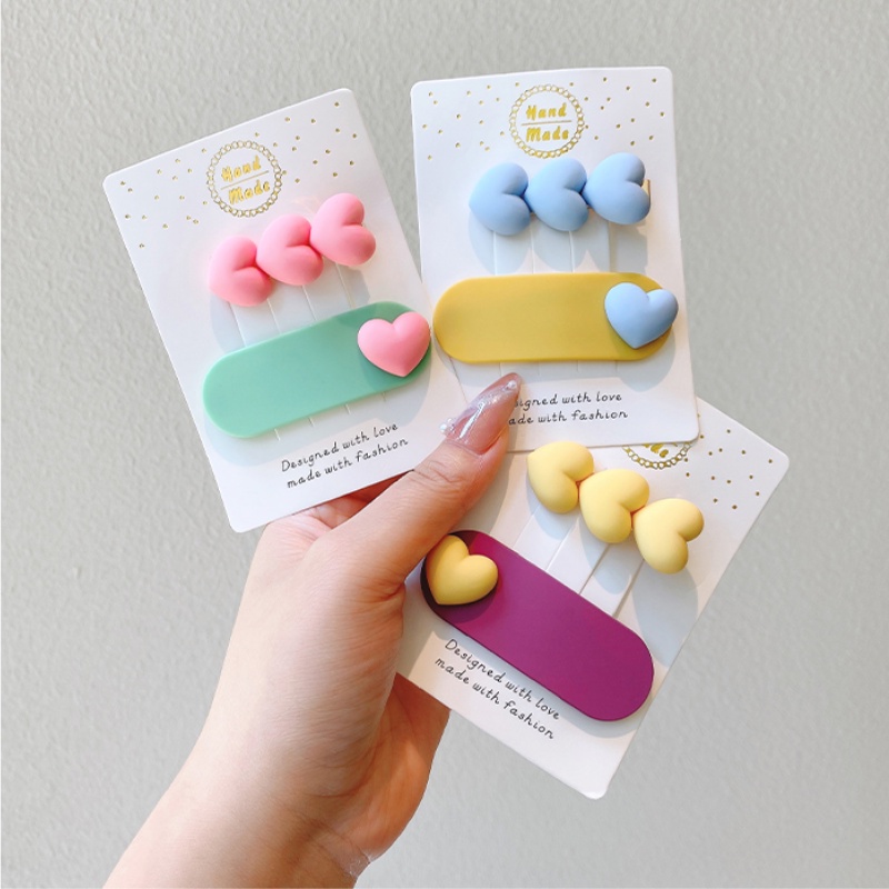 Kẹp tóc nhựa hình trái tim màu sắc đơn giản cho bé