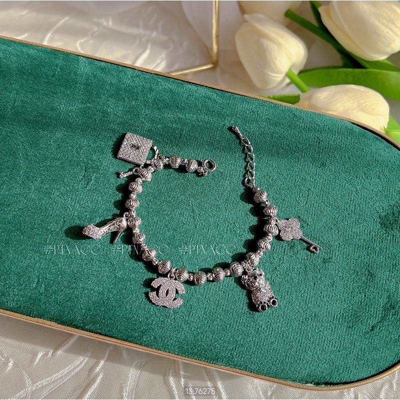 Lắc tay bi xi bạch kim phối 5 charm tòn ten hình gấu logo thương hiệu .PTNACC.