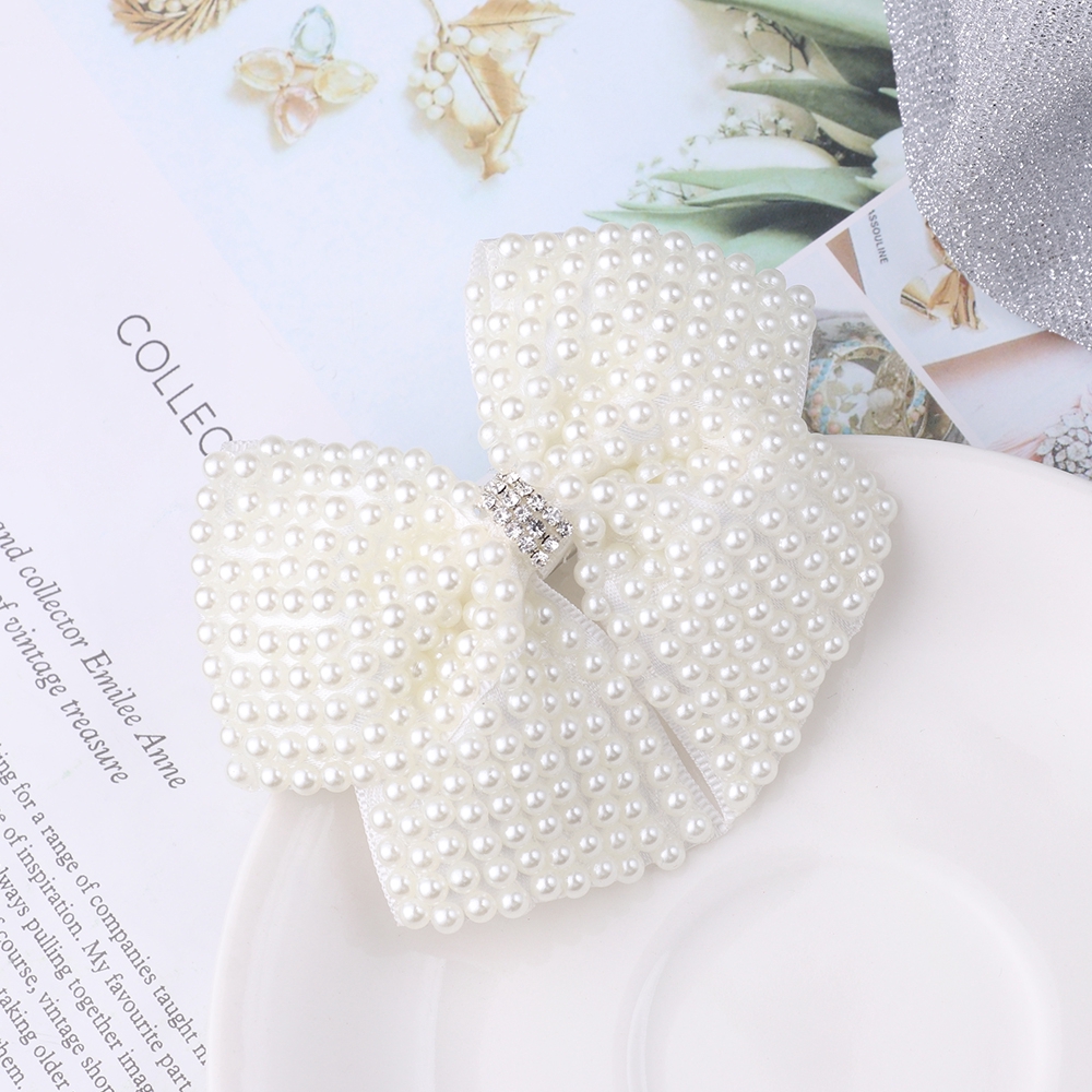 Kẹp tóc kiểu nơ đính ngọc trai giả dành cho bé gái