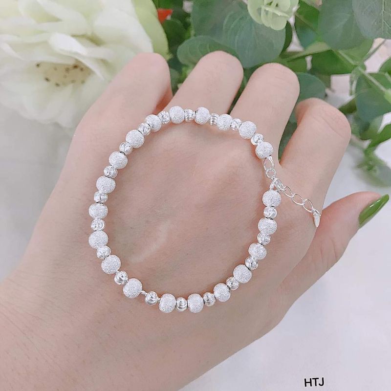 Lắc tay bi bạc ta cho nữ