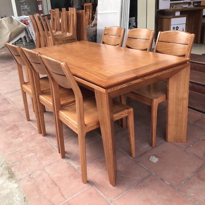 Bàn ăn mặt gỗ chân vát