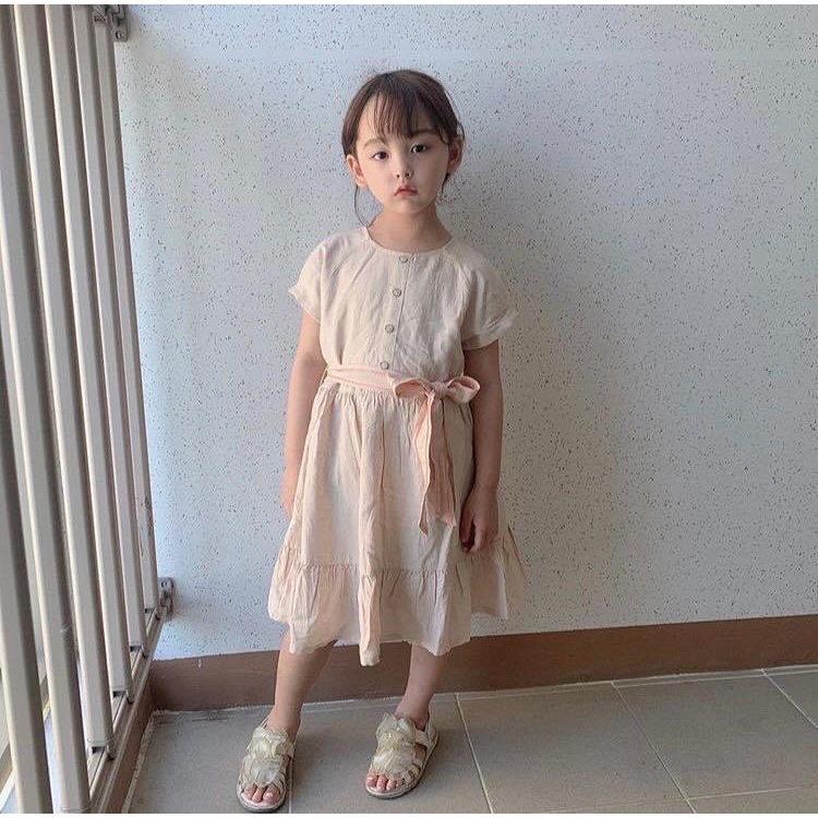 Váy thô đũi Curly Sue màu be kèm dây đai xuất Hàn 110-150