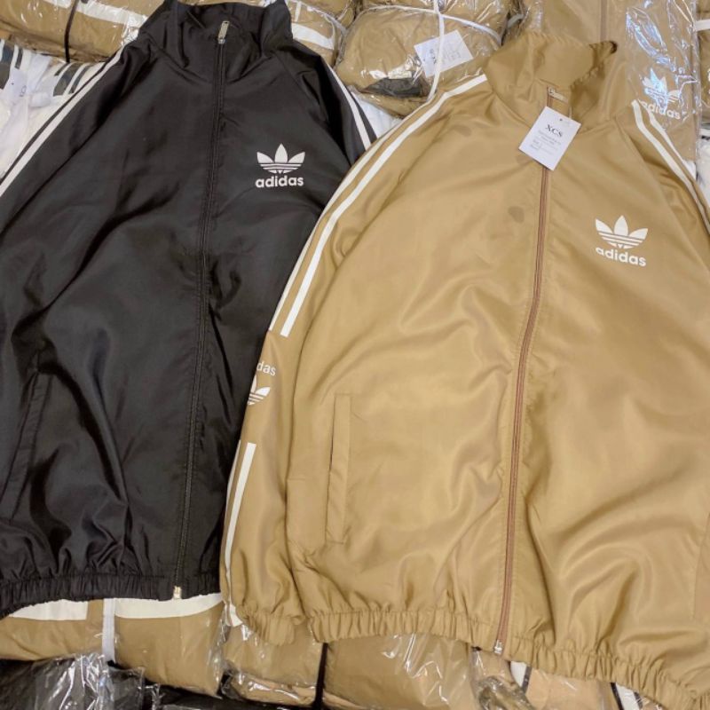 Khoác dù adidas 3 sọc cặp nam nữ đều mặc được phom to dưới 65kg