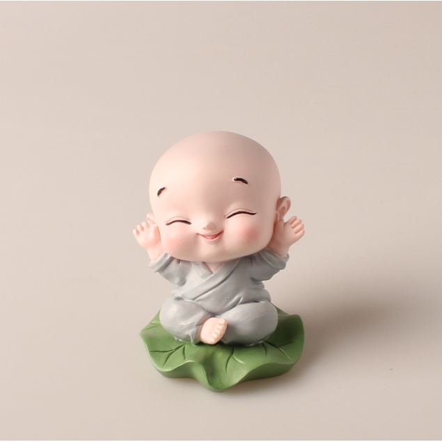 Tượng chú tiểu ngồi đài sen, lá sen bình an ngộ nghĩnh