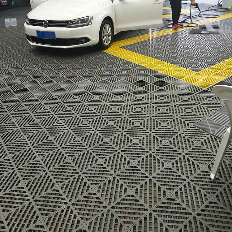 Tấm lót sàn nhựa cho trung tâm chăm sóc xe Gara ô tô - Chạm rửa xe.