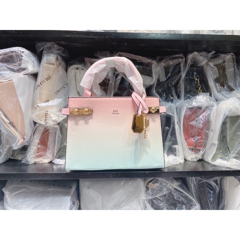 Túi lyn tay cầm hồng loang xanh