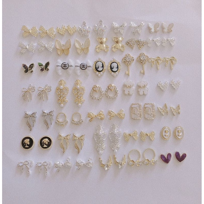 set charm nail 70v 210k. sale 3k 1 viên