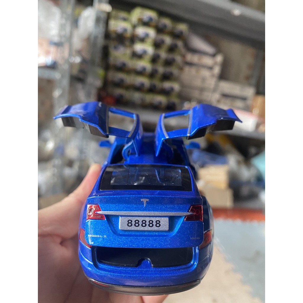 Đồ chơi mô hình xe TESLA KAVY chất liệu hợp kim có nhạc đèn mở được tất cả cánh cửa tỷ lệ 1:32
