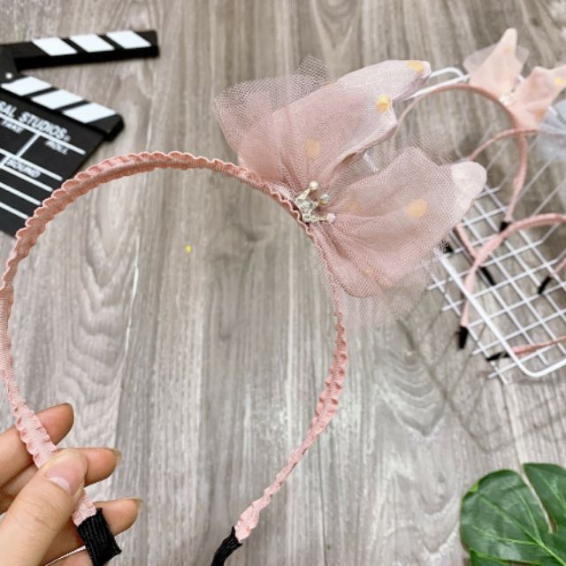 Bờm nơ lệch cho bé gái