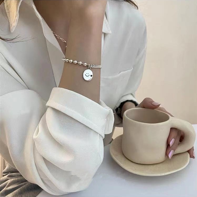 Vòng tay phối hạt giả ngọc trai và hình mặt cười thời trang Hàn Quốc