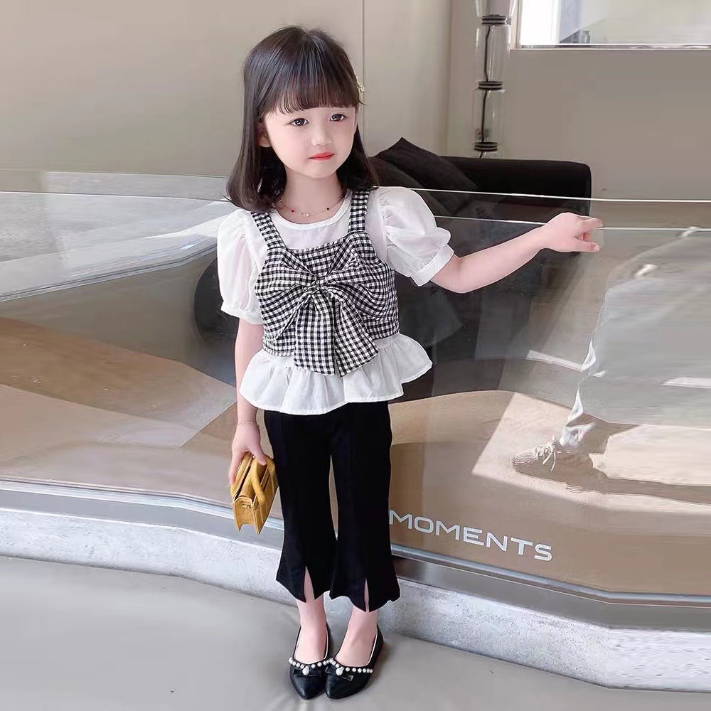 Xả hàng_Bộ bé gái áo nơ kẻ caro đen trắng và quần loe gấu 10-30kg XHN935