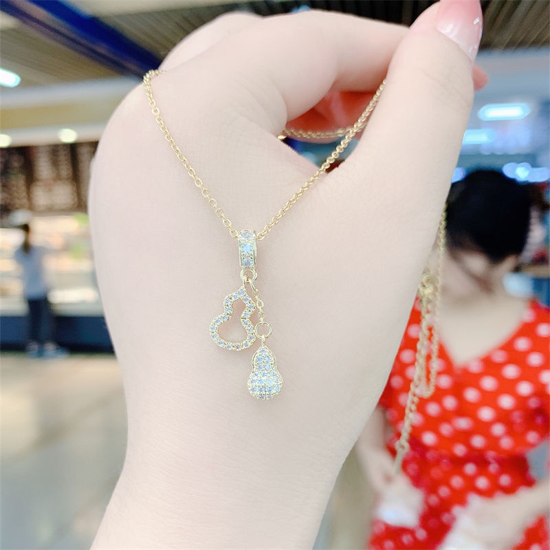 Dây chuyền hai mặt hình quả hồ lô bằng chất liệu thép titan màu vàng đồng đính đá không phai màu dành cho bạn nữ