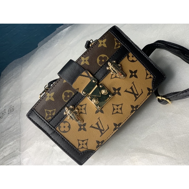 Tui cầm tay hoạ tiết