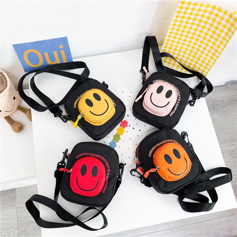 Túi Đeo Chéo Vai Hình Tròn Nhỏ Vải Canvas Họa Tiết Mặt Cười Hoạt Hình Dễ Thương Cho Trẻ Em