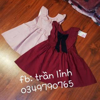Váy buộc nơ bé gái qc