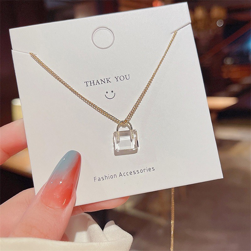 Vòng cổ mặt hình túi xách bằng thép titan đính pha lê