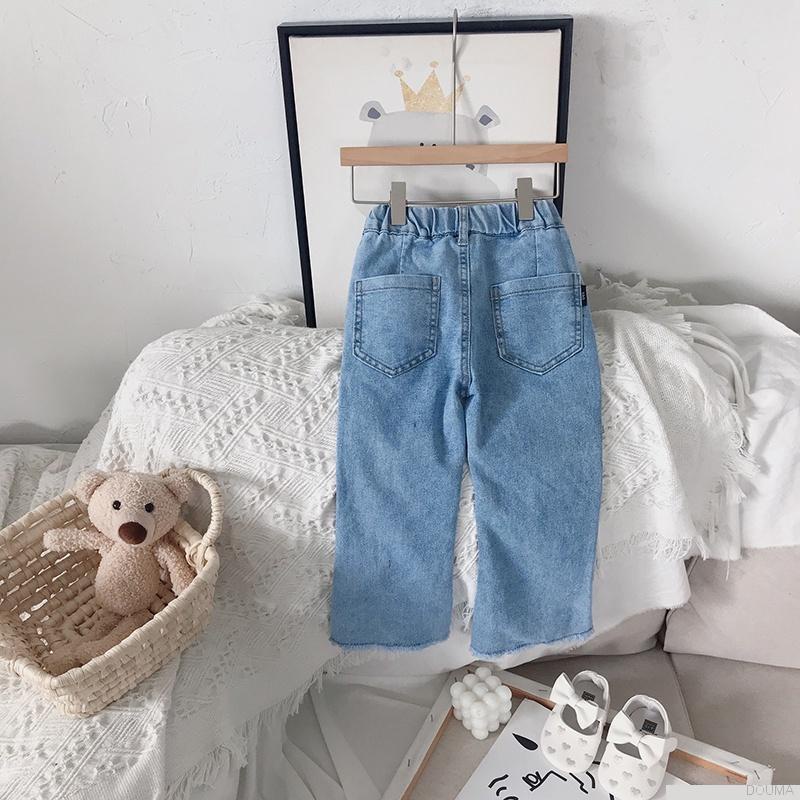 Quần jeans ống loe đính nơ thời trang cho bé gái