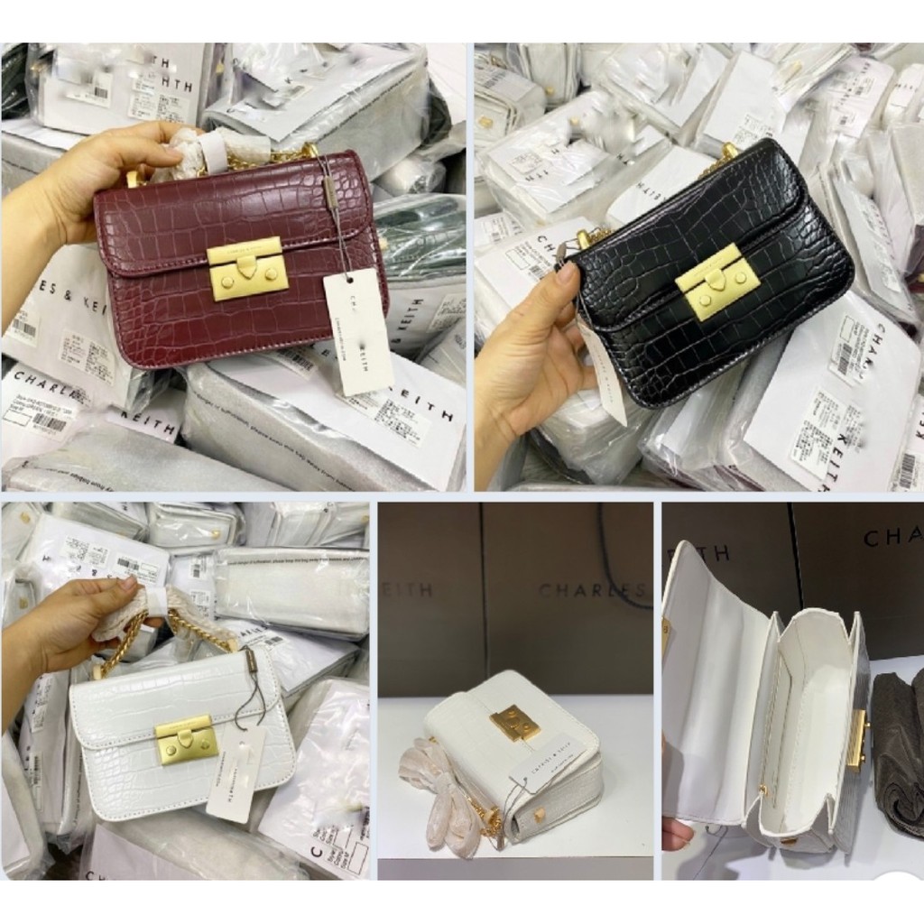 Túi chữ C vân rắn đinh sườn size 18
