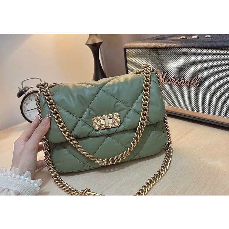 Túi ô trần khoá xoay chất da mới