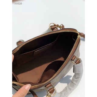 Túi Coach hến da thật pha pu canvas