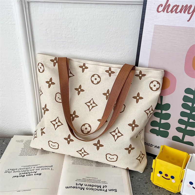 Túi nữ sinh lớp sinh viên túi lớn túi đi học 2022 hợp thời trang mới in vải đeo vai túi tote túi bảo vệ môi trường