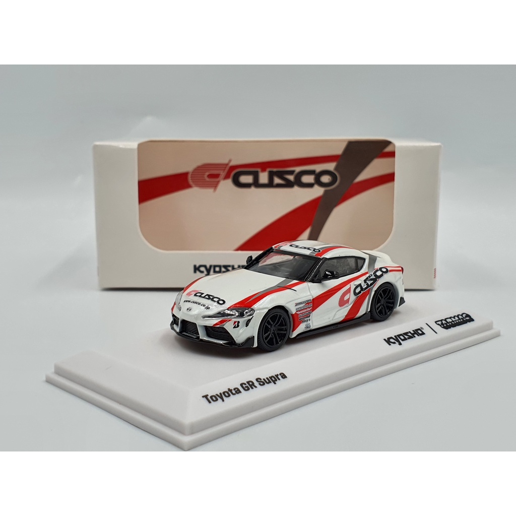 Xe Mô Hình Toyota GR Supra CUSCO 1:64 Tarmac Works/Kyosho (Trắng)