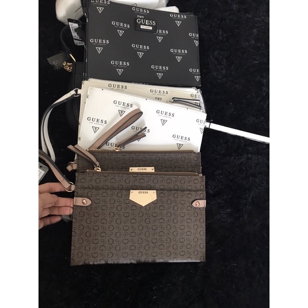 Ví cầm tay nữ guess logo  us