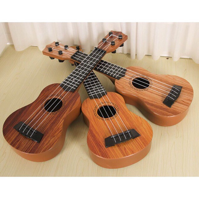 siêu hót Đàn Ukulele Nhựa Cho Bé - Đàn Ghi Ta Mini DTE