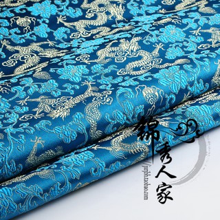 Vải họa tiết thêu hình rồng nền xanh dương dùng may sườn xám/trang phục truyền thống Trung Hoa