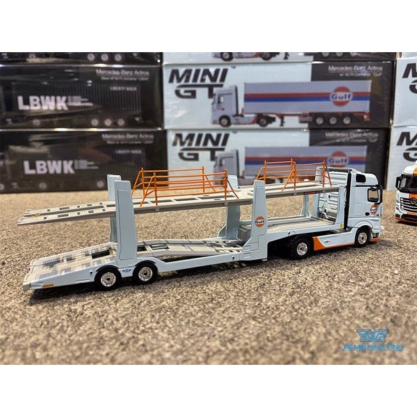 Xe Mô Hình Mercedes-Benz Actros W/ Car Carrie Trailer &quot;Gulf&quot; LHD 1:64 Mini GT (Xanh)