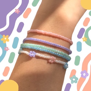 Handmade - Vòng tay hạt cườm màu trơn phối hoa daisy