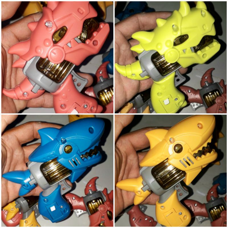 Một cái mô hình khủng long hoặc cá mập bằng nhựa có nhạc và đèn led rất đẹp có sẵn pin