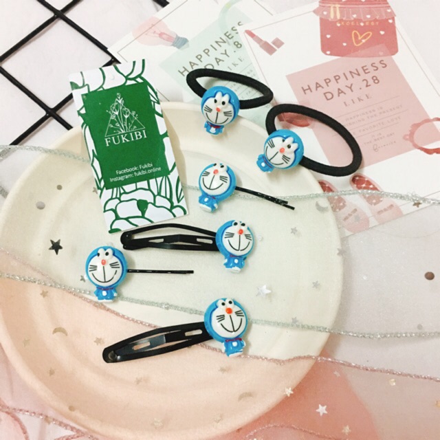 CỘT TÓC, KẸP TÓC DORAEMON ẢNH THẬT