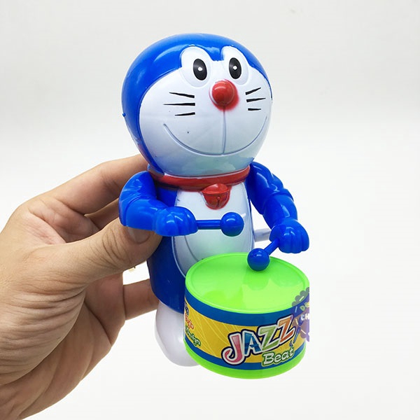 Đồ chơi Doraemon đánh trống mini vặn cót bằng nhựa dể thương