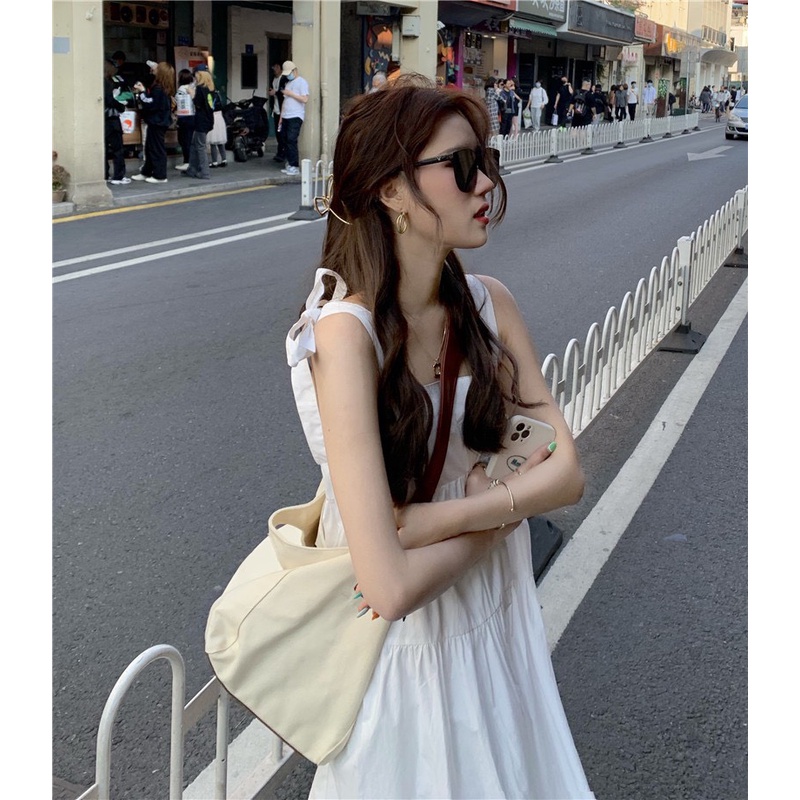 Váy hai dây trắng dáng dài buộc nơ trơn 2 màu xanh trắng đi biển GuZ