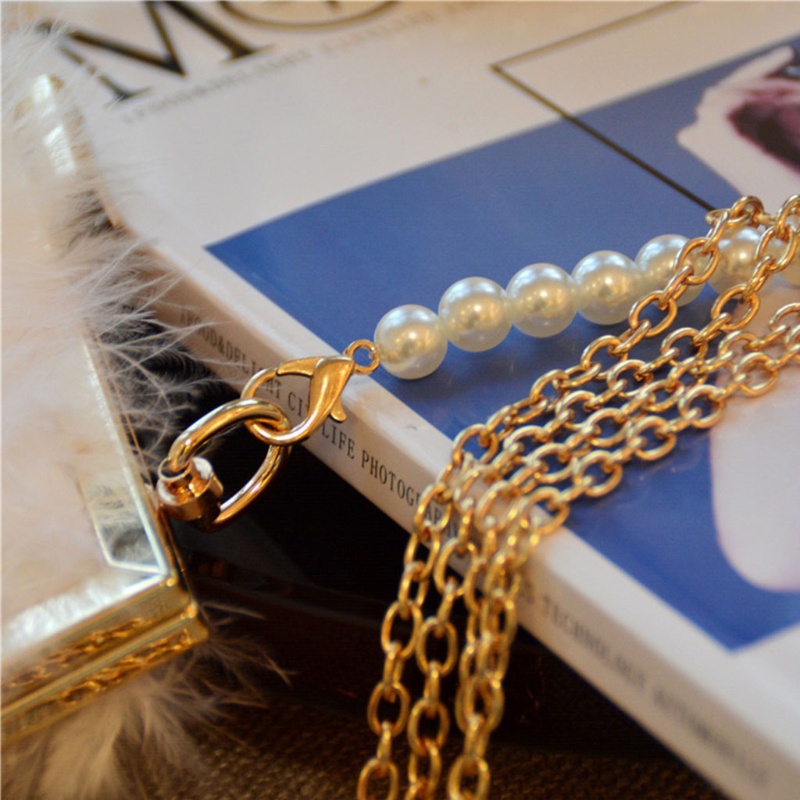 Ví cầm tay đính lông vũ thời trang dự tiệc