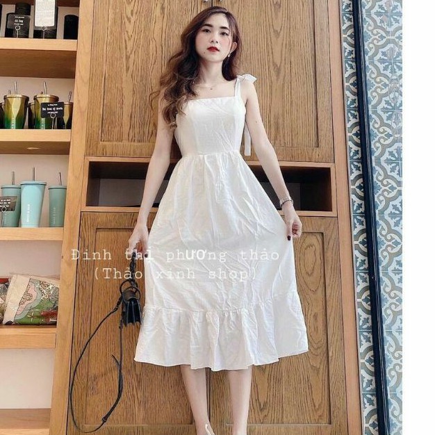 Đầm 2 dây cột nơ vải đũi cao cấp chất mịn và mát.