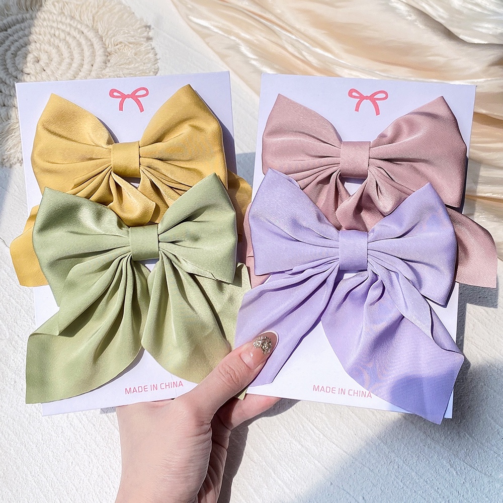 Set 2 kẹp tóc KIDSBOWS hình nơ họa tiết hoa xinh xắn dành cho nữ