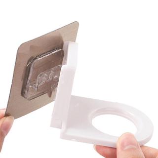 A space-saving multi-purpose kitchen / bathroom wall-mounted bottle holder