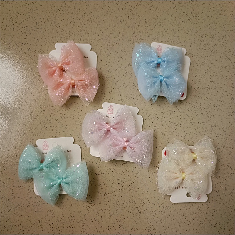 Kẹp tóc cho bé kiểu nơ hoạt hình