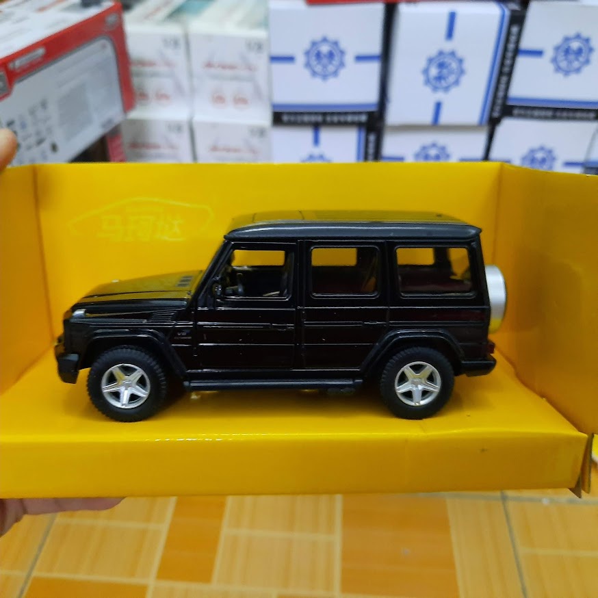 Mô hình xe ô tô Mercedes G63 AMG tỉ lệ 1:36 Đồ chơi trẻ em bằng sắt mở 2 cửa bên