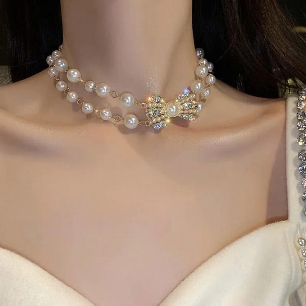 Vòng cổ choker hai lớp đính ngọc trai và nơ thời trang