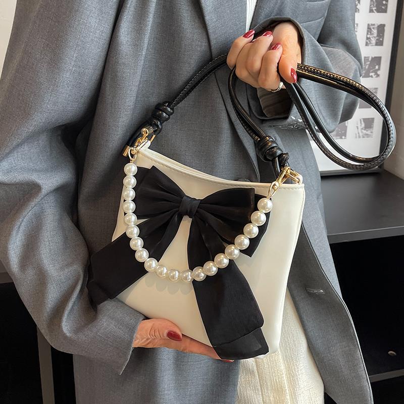 Túi đeo chéo Ielgy dạng xô thắt nơ thích hợp cho tất cả các phong cách dành cho bạn nữ