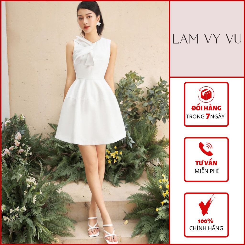 Đầm sát nách dáng xoè xoắn nơ cổ LAMVYVU tafta lụa.Chất vài mềm, co giãn, mặt vải có độ bóng sang trọng