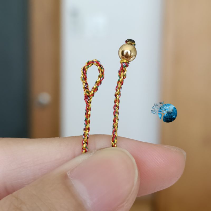 Vòng tay tết dây chỉ ngũ sắc mix hoa đồng tiền vàng kim